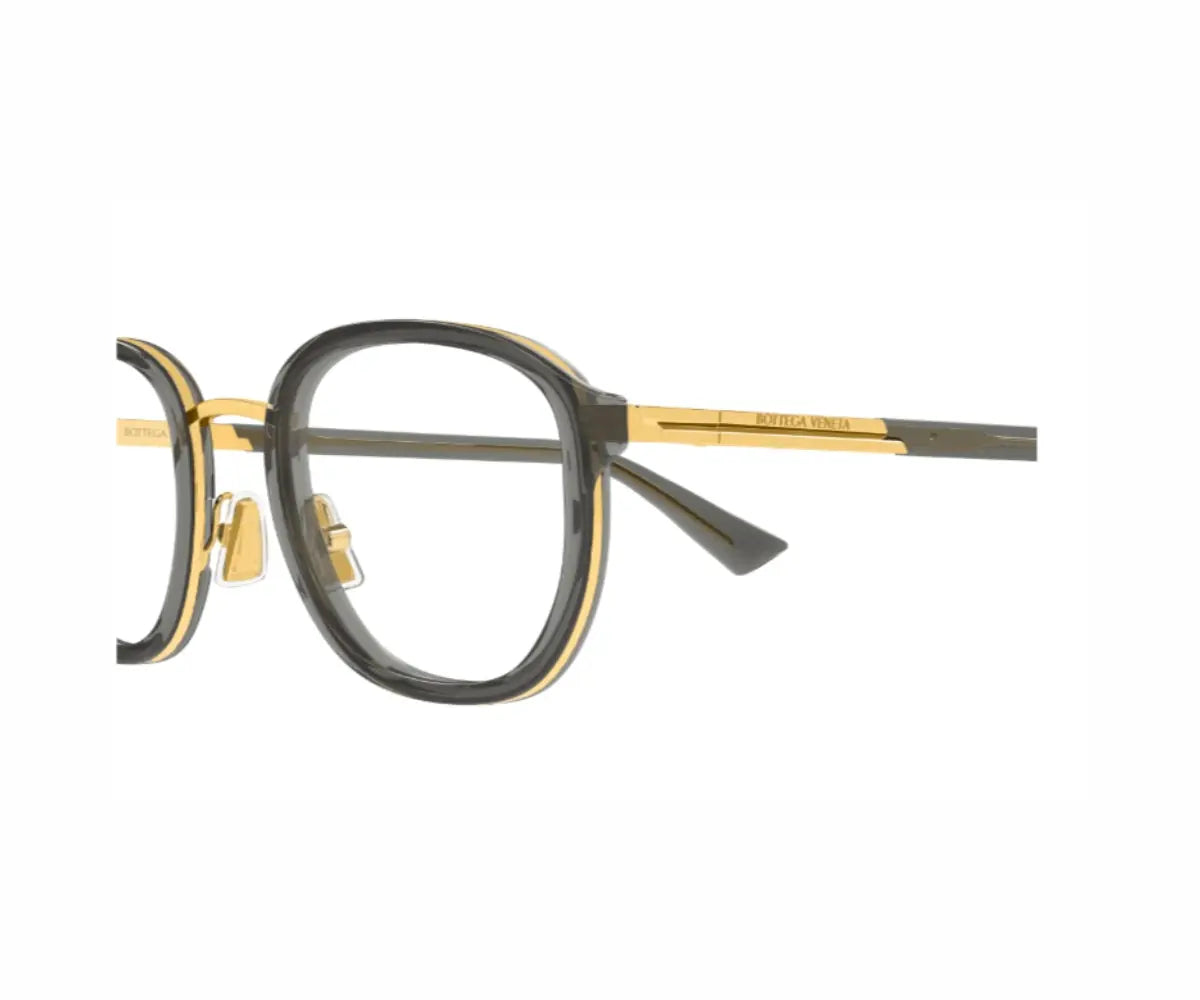 Eyeglasses with black and gold frame on a white background