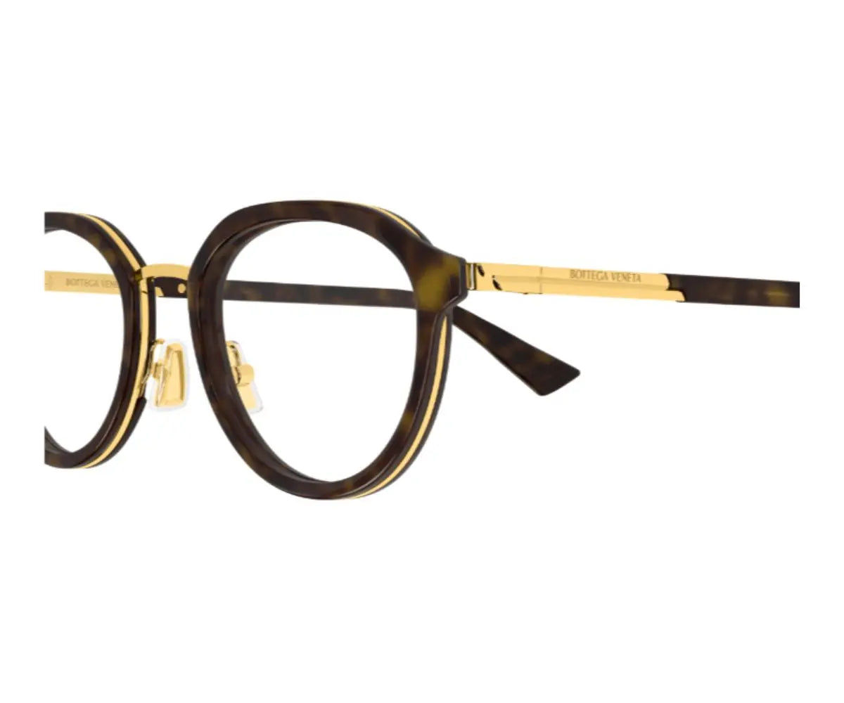 Round eyeglasses with gold accents on a white background