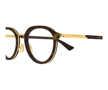 Round eyeglasses with gold accents on a white background