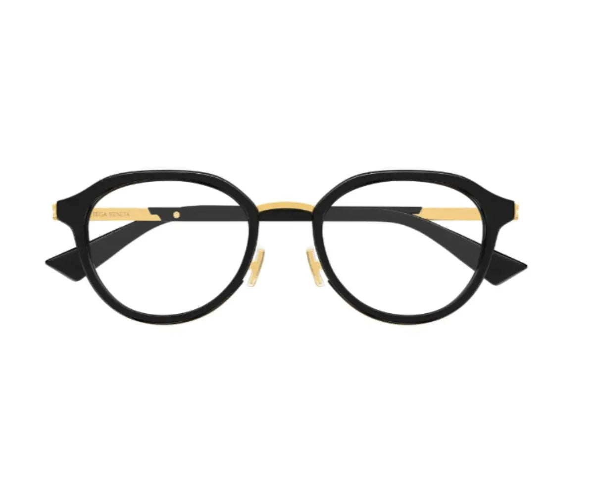 Black and gold eyeglasses on a white background
