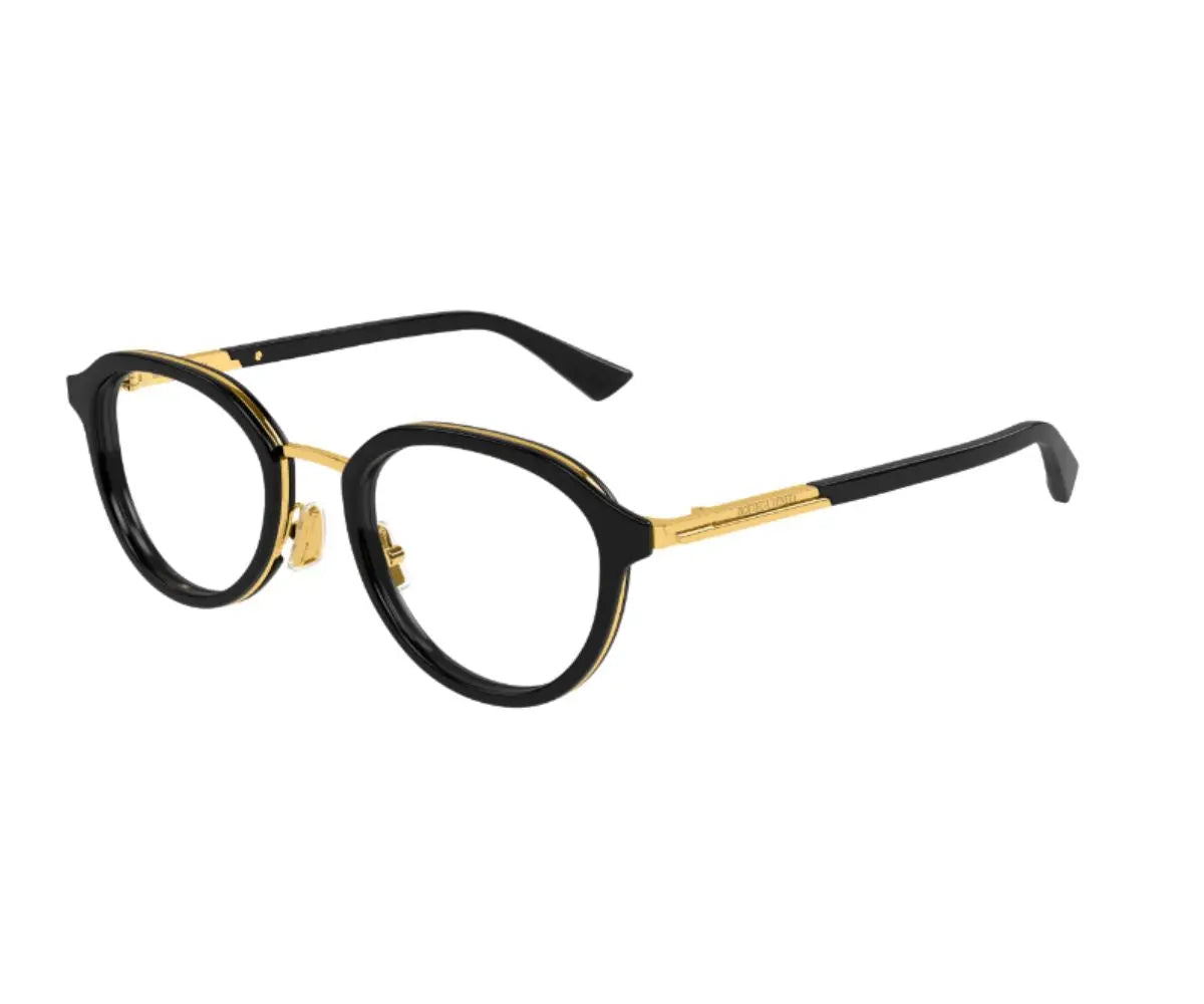 Black and gold eyeglasses on a white background