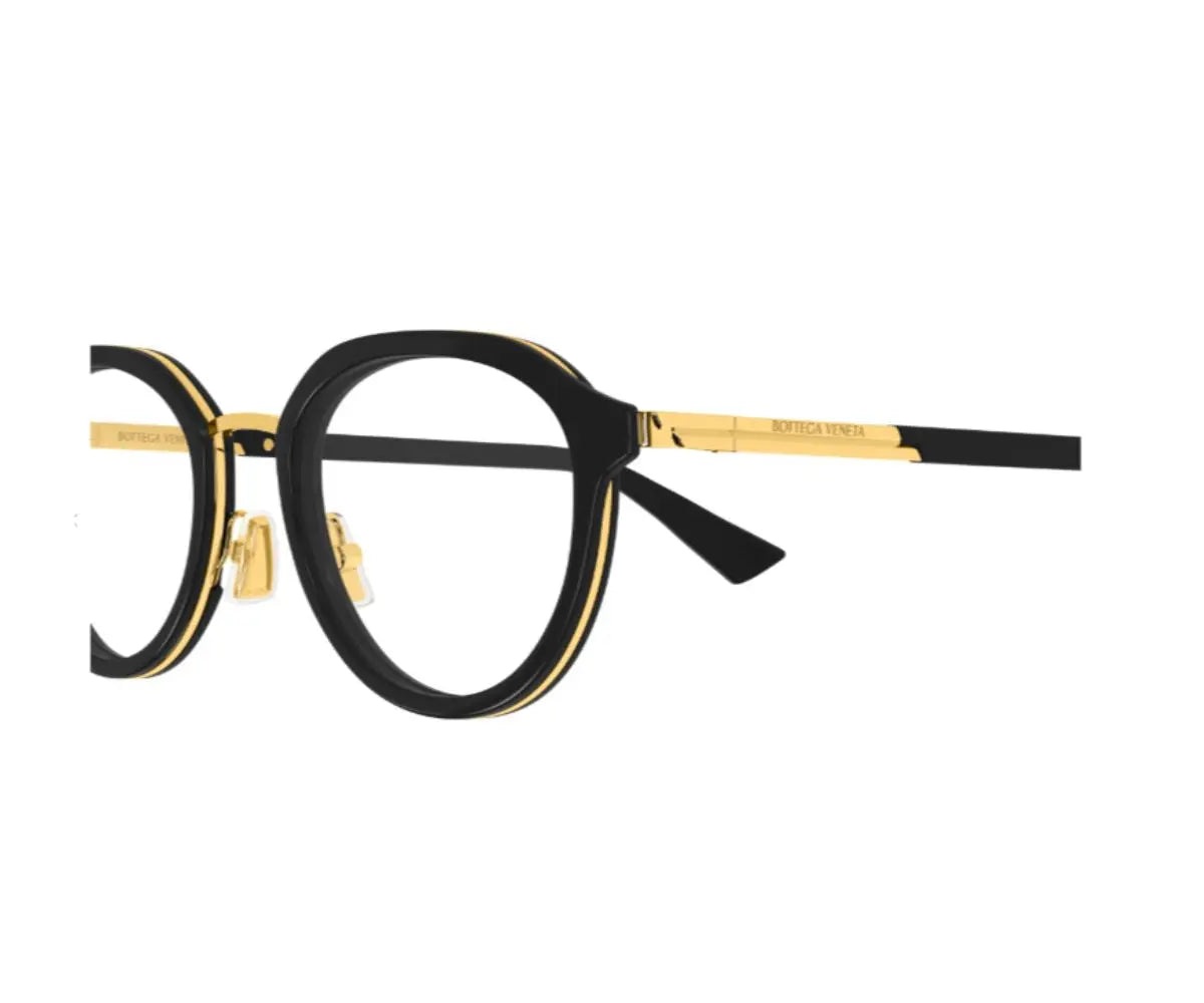 Black and gold eyeglasses on a white background