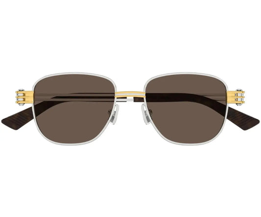 Sunglasses with gold frame and dark lenses on a white background