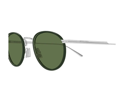 Sunglasses with green lenses and thin metal frame on a white background