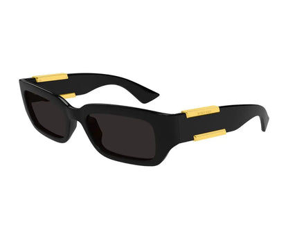 Black sunglasses with gold accents on a white background