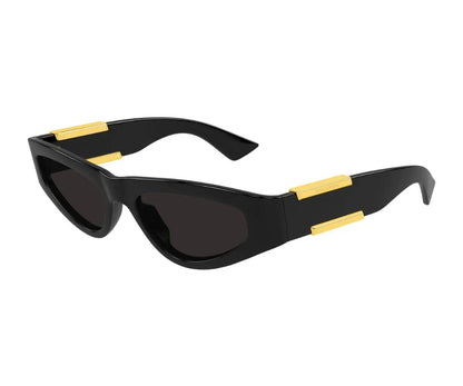 Black sunglasses with gold accents on a white background