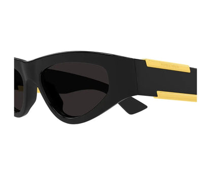 Black sunglasses with gold accents on a white background