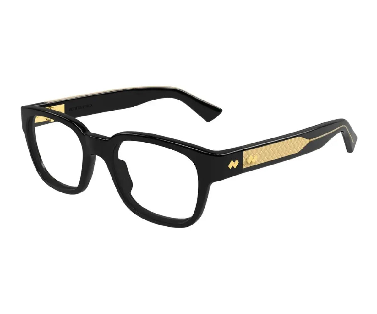 Black and gold eyeglasses on a white background