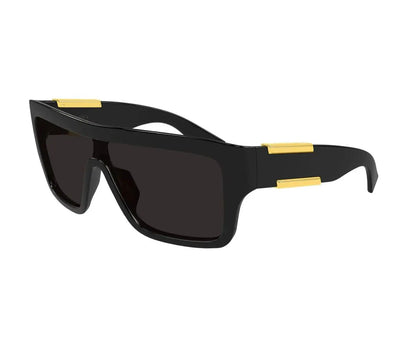 Black sunglasses with gold accents on a white background