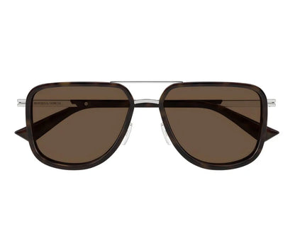 Sunglasses with brown lenses and black frame on a white background