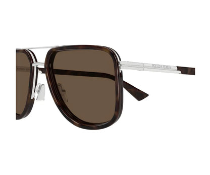 Sunglasses with brown lenses and a silver frame on a white background