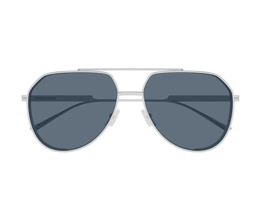 Aviator sunglasses with dark lenses and silver frame on a white background