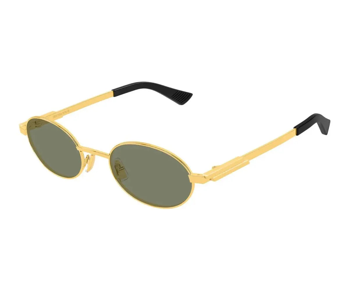 Gold-framed sunglasses with black arms on a white background