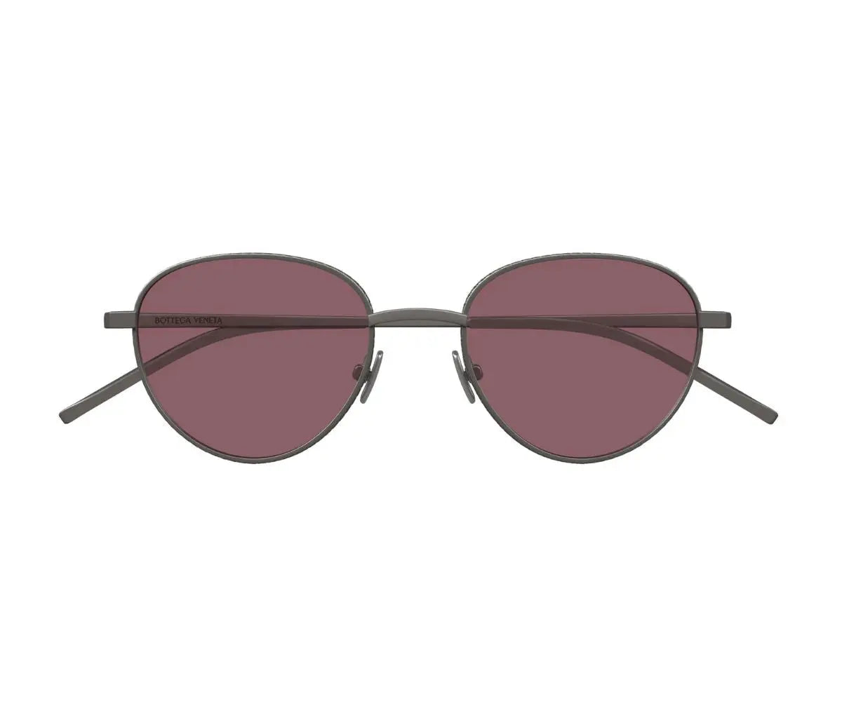 Sunglasses with round lenses and dark frames on a white background