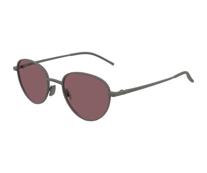 Sunglasses with dark red lenses and thin metal frame on a white background