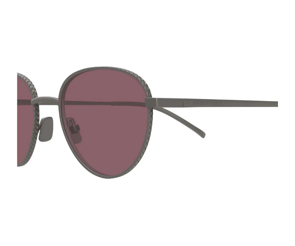 Sunglasses with dark lenses and thin frame on a white background