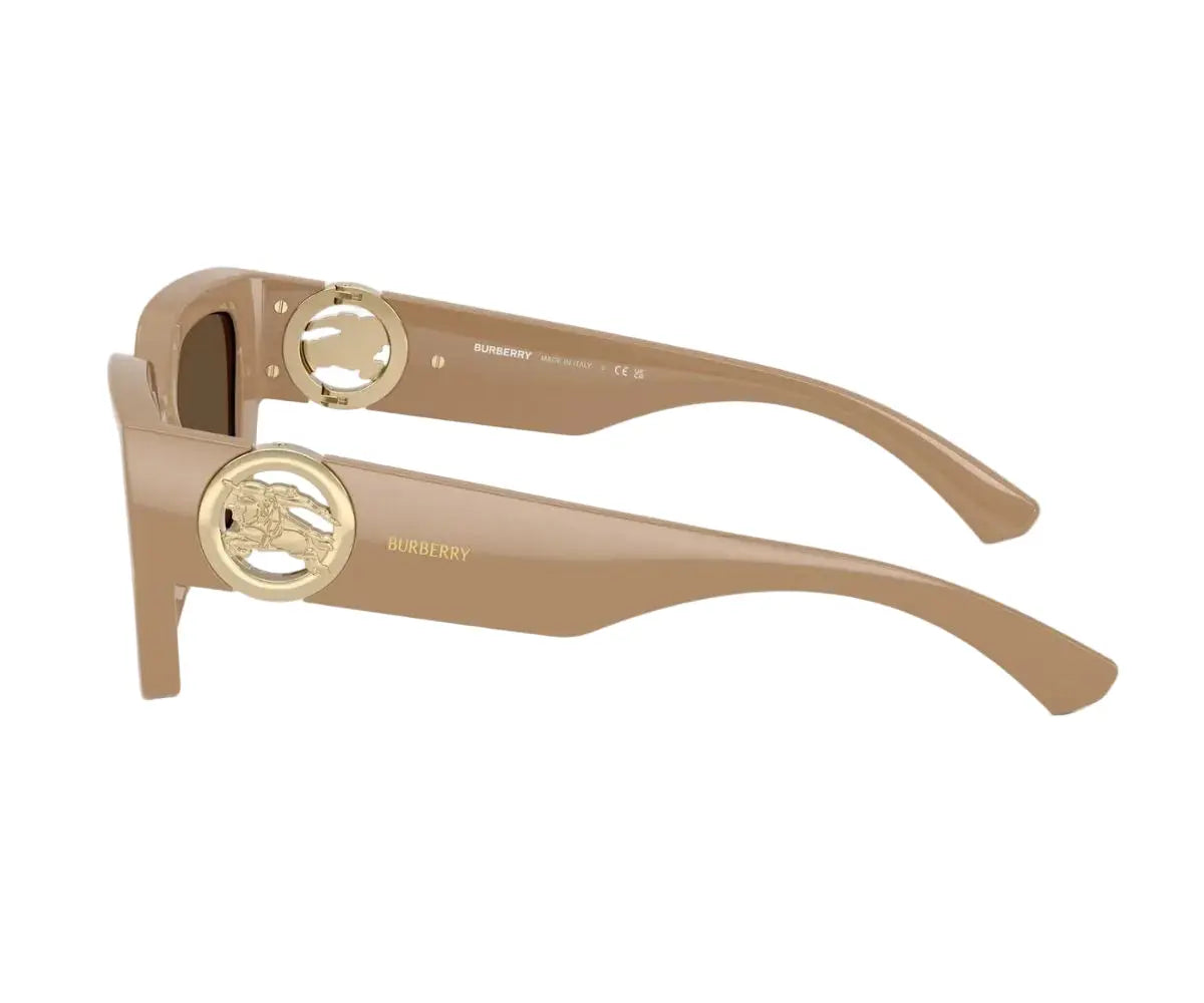 Beige sunglasses with gold accents on a white background