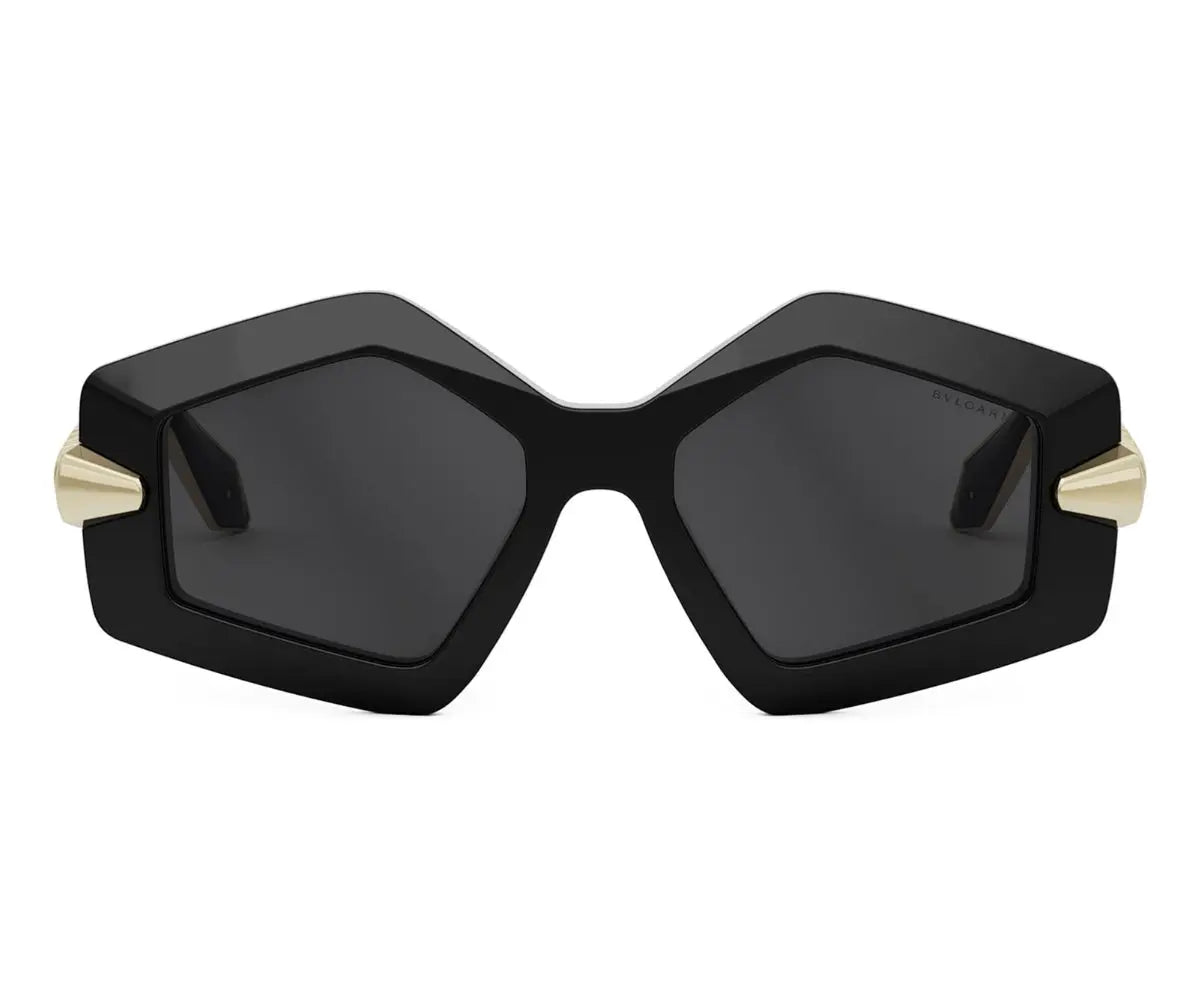 Black hexagonal sunglasses with gold accents on a white background