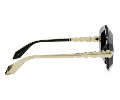 Sunglasses with gold frames and black lenses on a white background