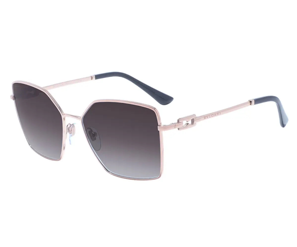 Sunglasses with a rose gold frame and dark gradient lenses on a white background