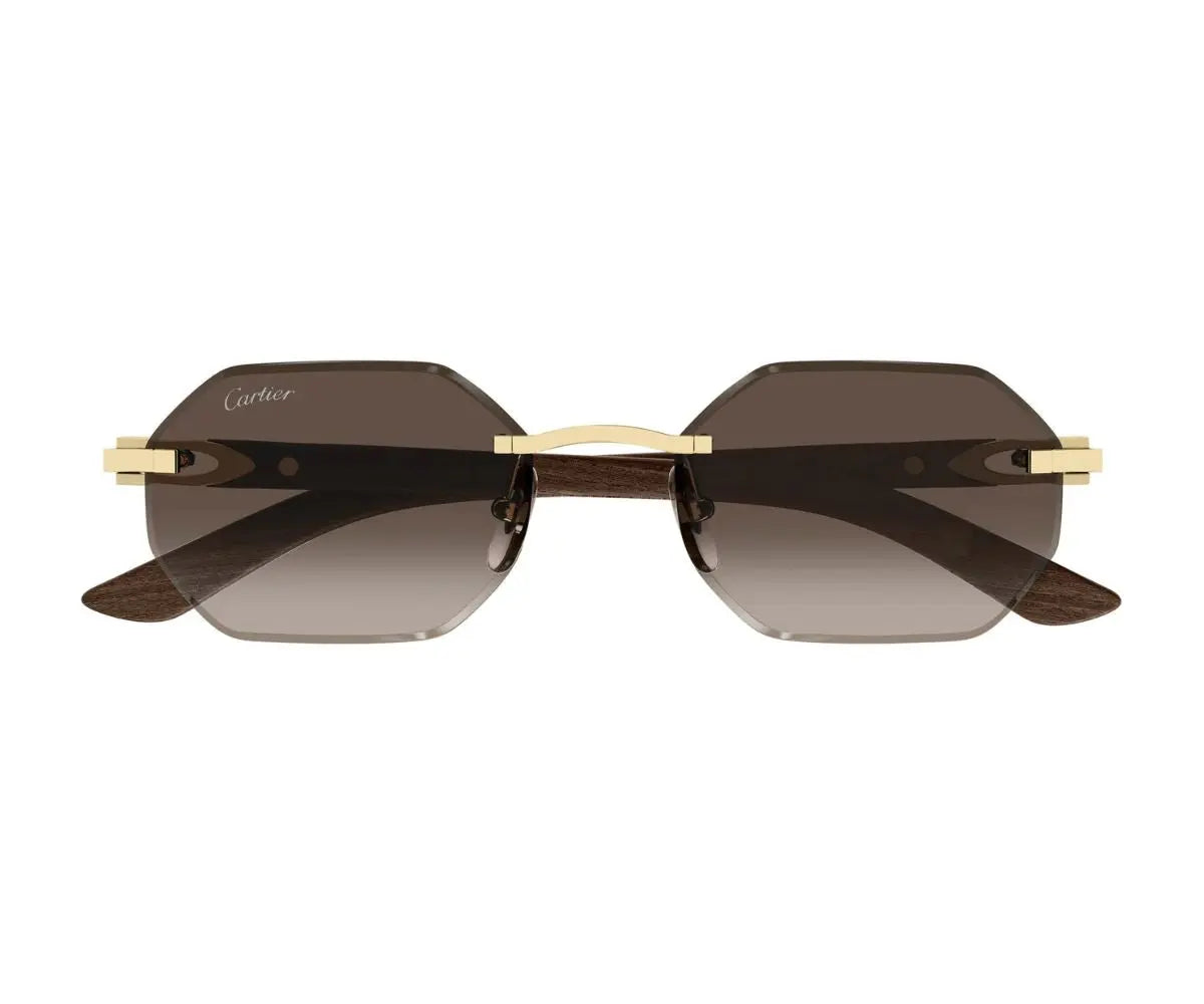Sunglasses with gold frame and dark lenses on a white background