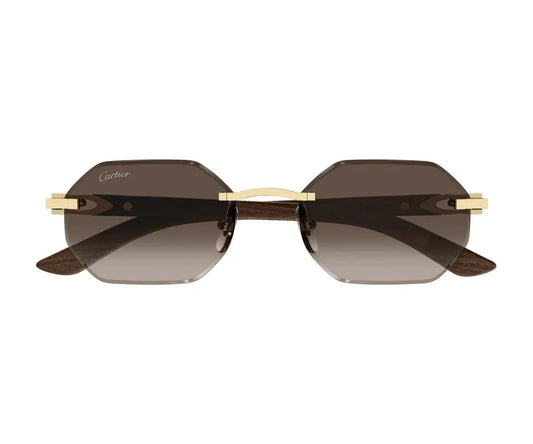 Sunglasses with gold frame and dark lenses on a white background