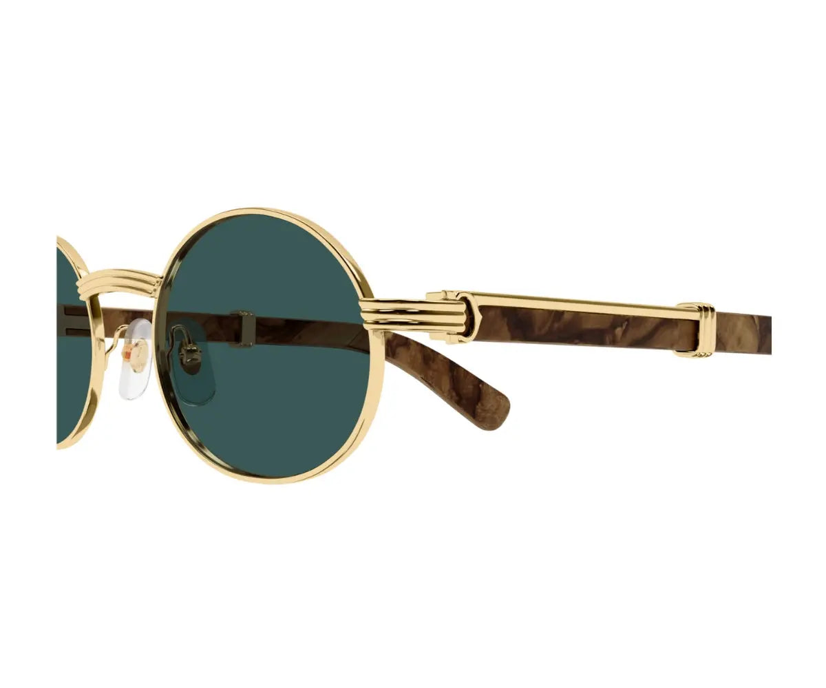 Gold-framed sunglasses with green lenses on a white background