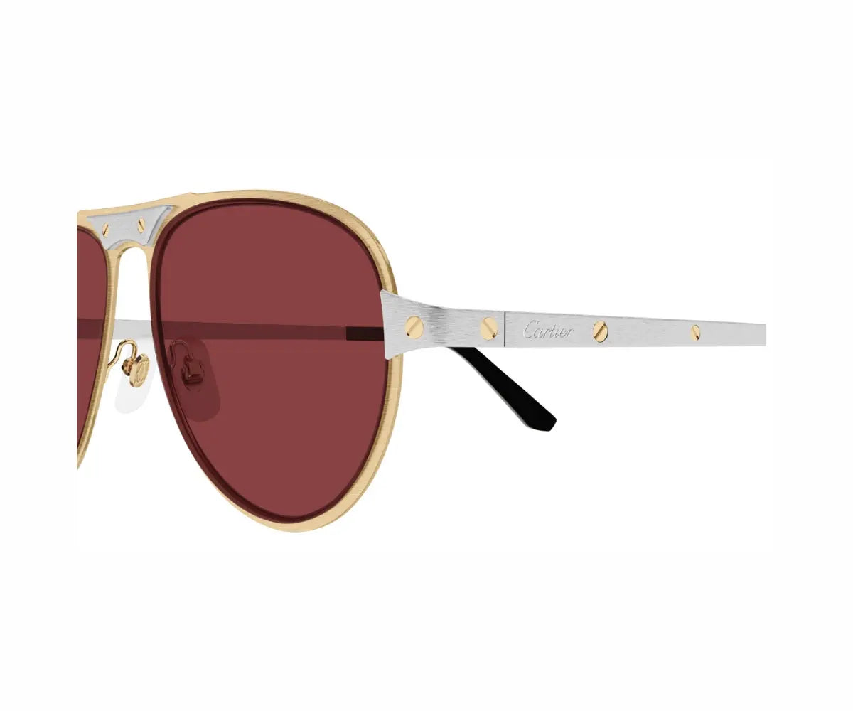 Sunglasses with gold frame and red lenses on a white background