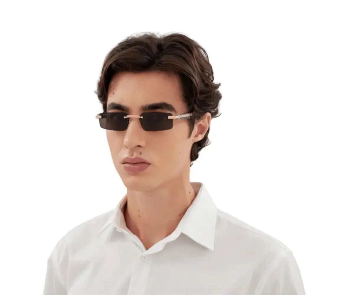 Man wearing sunglasses and a white shirt on a white background