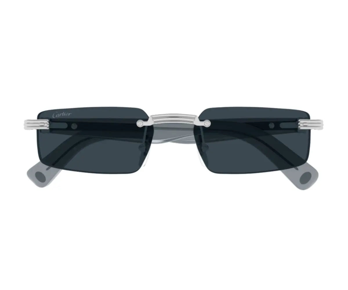 Sunglasses with dark lenses and thin metal frame on a white background