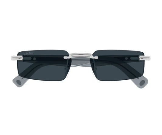 Sunglasses with dark lenses and thin metal frame on a white background