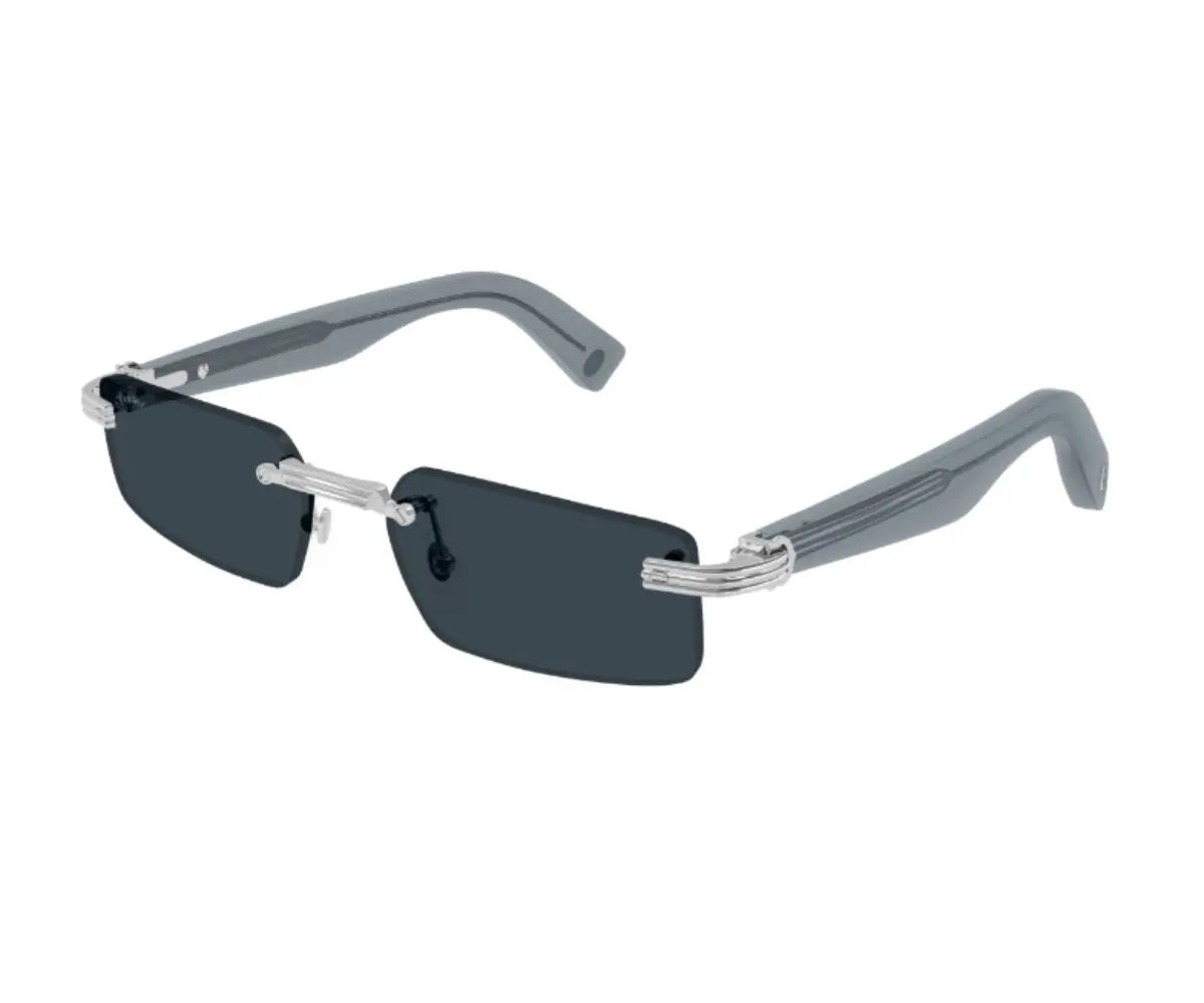 Sunglasses with thin frame and dark lenses on a white background