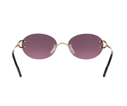 Sunglasses with purple lenses and gold frames on a white background
