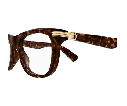 Tortoiseshell eyeglasses with gold accents on a white background