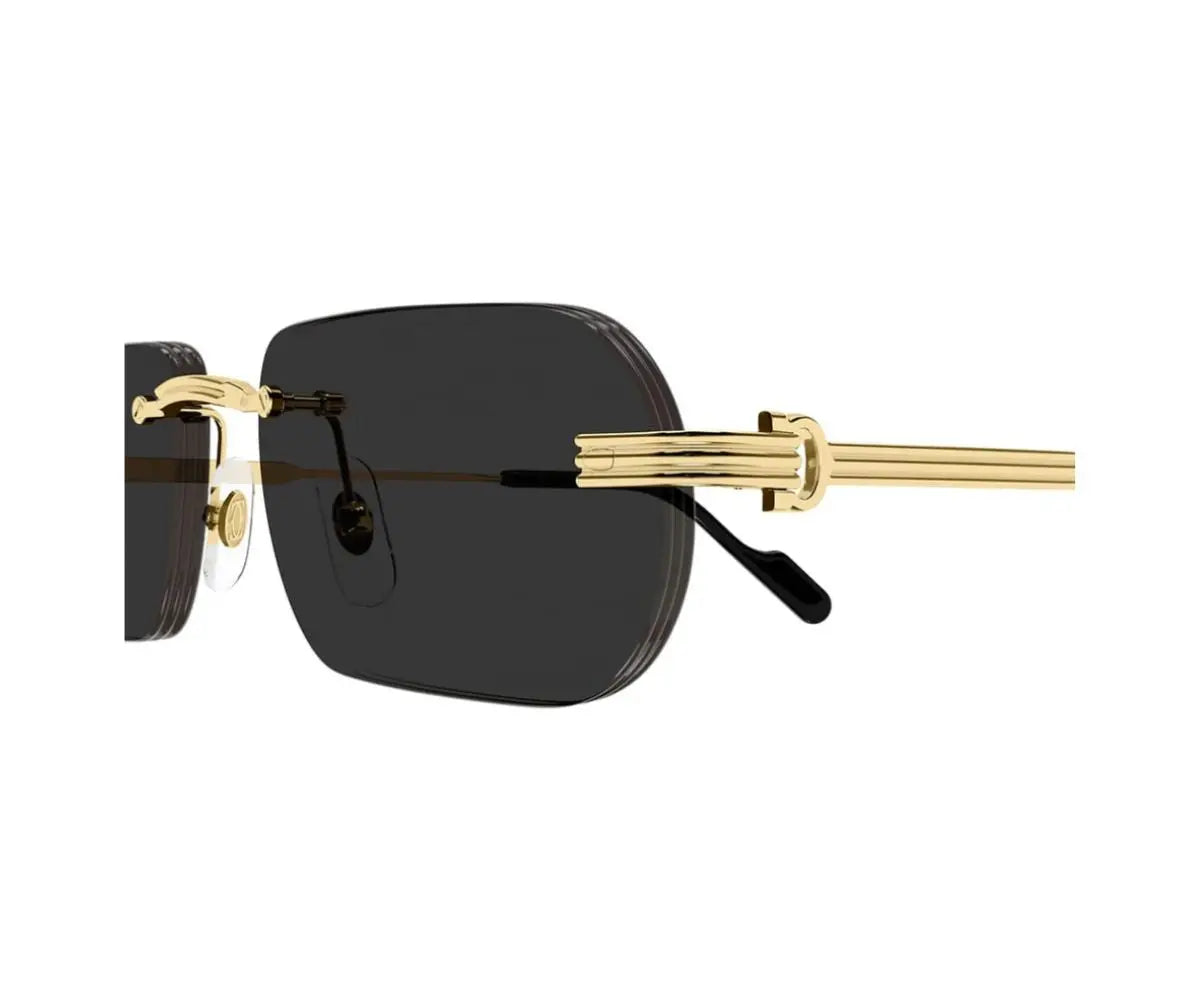 Sunglasses with gold frame and black lenses on a white background