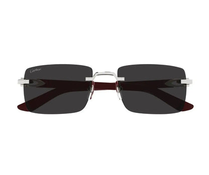 Sunglasses with dark lenses and thin frame on a white background