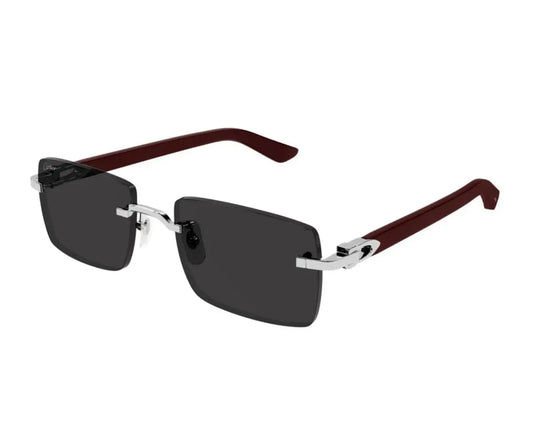 Sunglasses with dark lenses and brown and silver frame on a white background