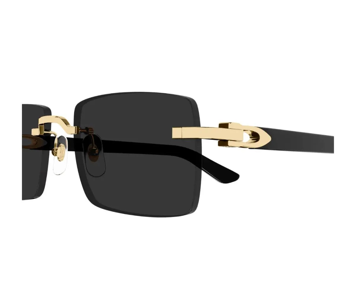 Sunglasses with gold frame and black lenses on a white background