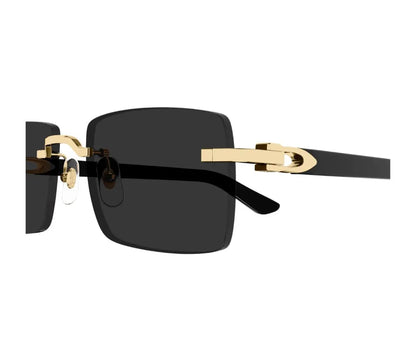 Sunglasses with gold frame and black lenses on a white background