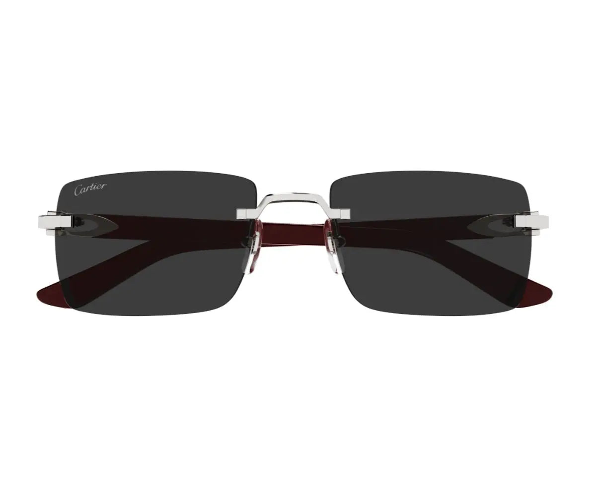 Sunglasses with dark lenses and silver frame on a white background