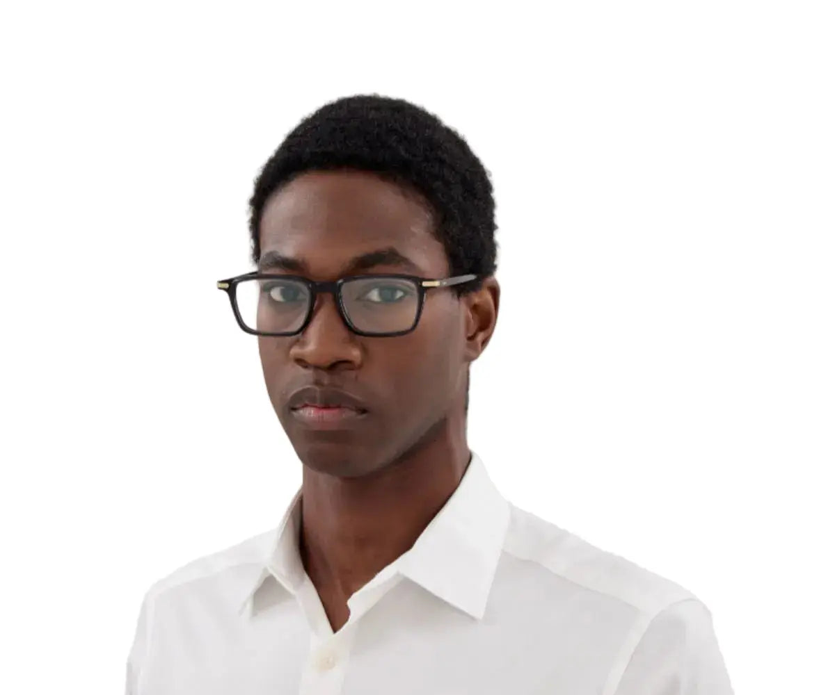 Person wearing glasses and a white shirt on a white background