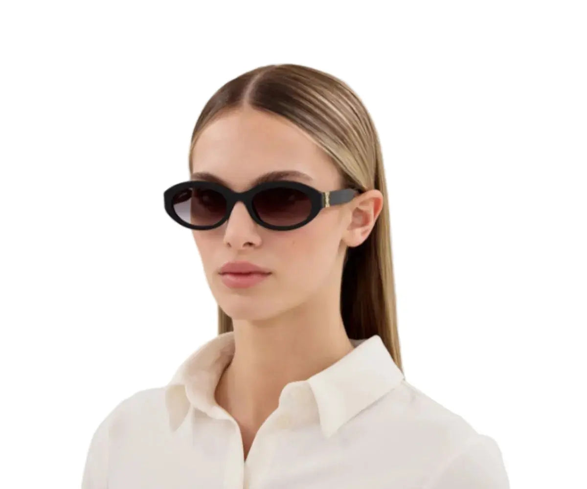 Woman wearing black sunglasses with a plain white background