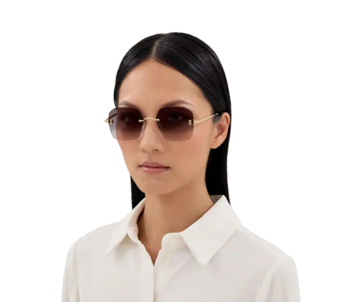 Woman wearing sunglasses with a plain white background