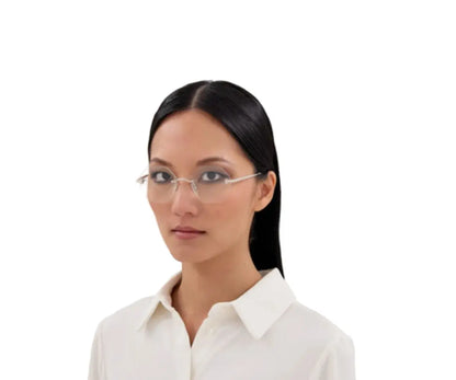 Woman wearing glasses and a white shirt on a white background