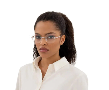 Woman wearing glasses and a white shirt on a white background