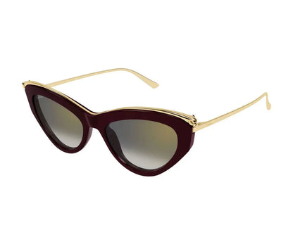 Sunglasses with gold frame and dark red lenses on a white background