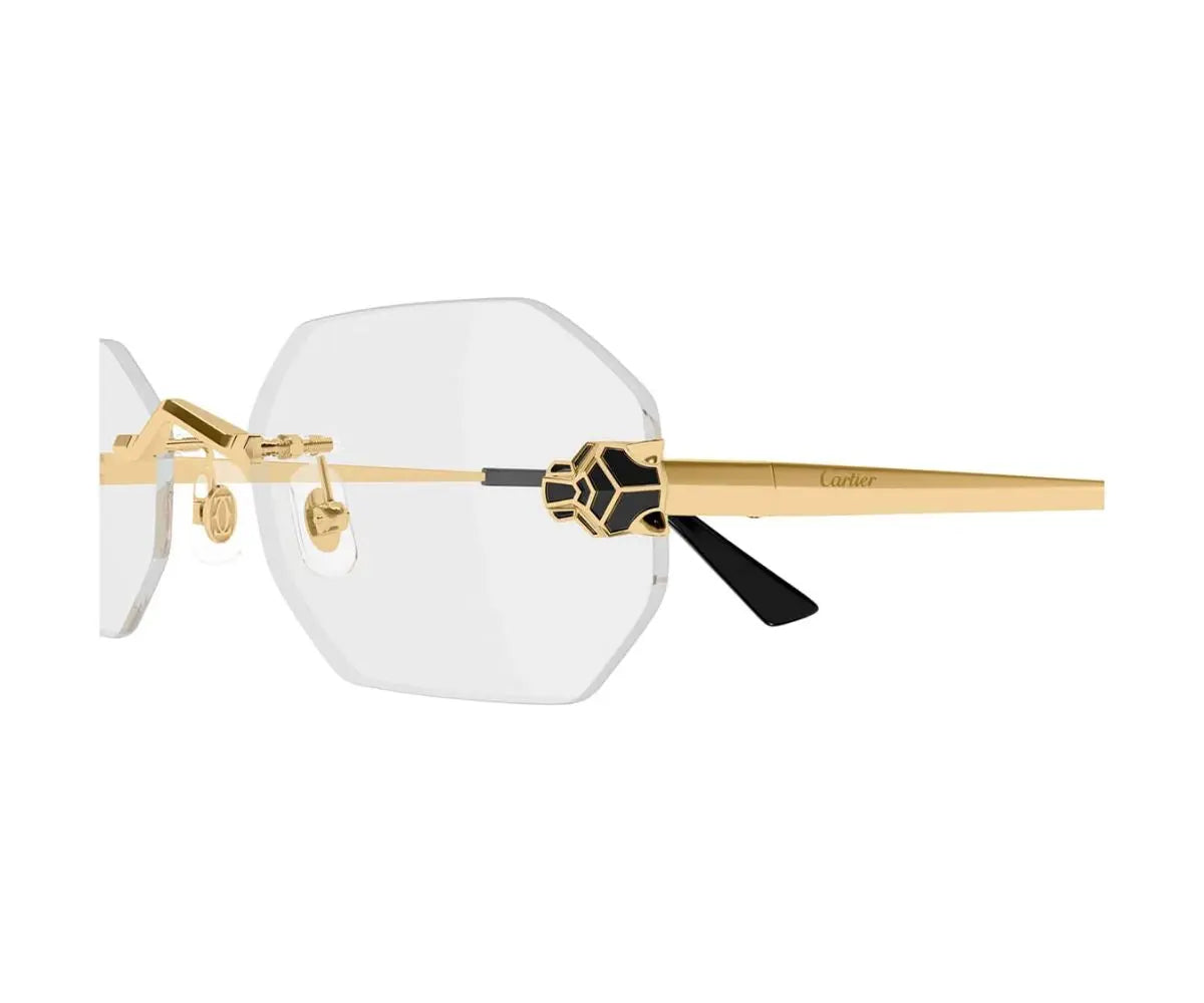 Gold-rimmed sunglasses with a clear lens on a white background