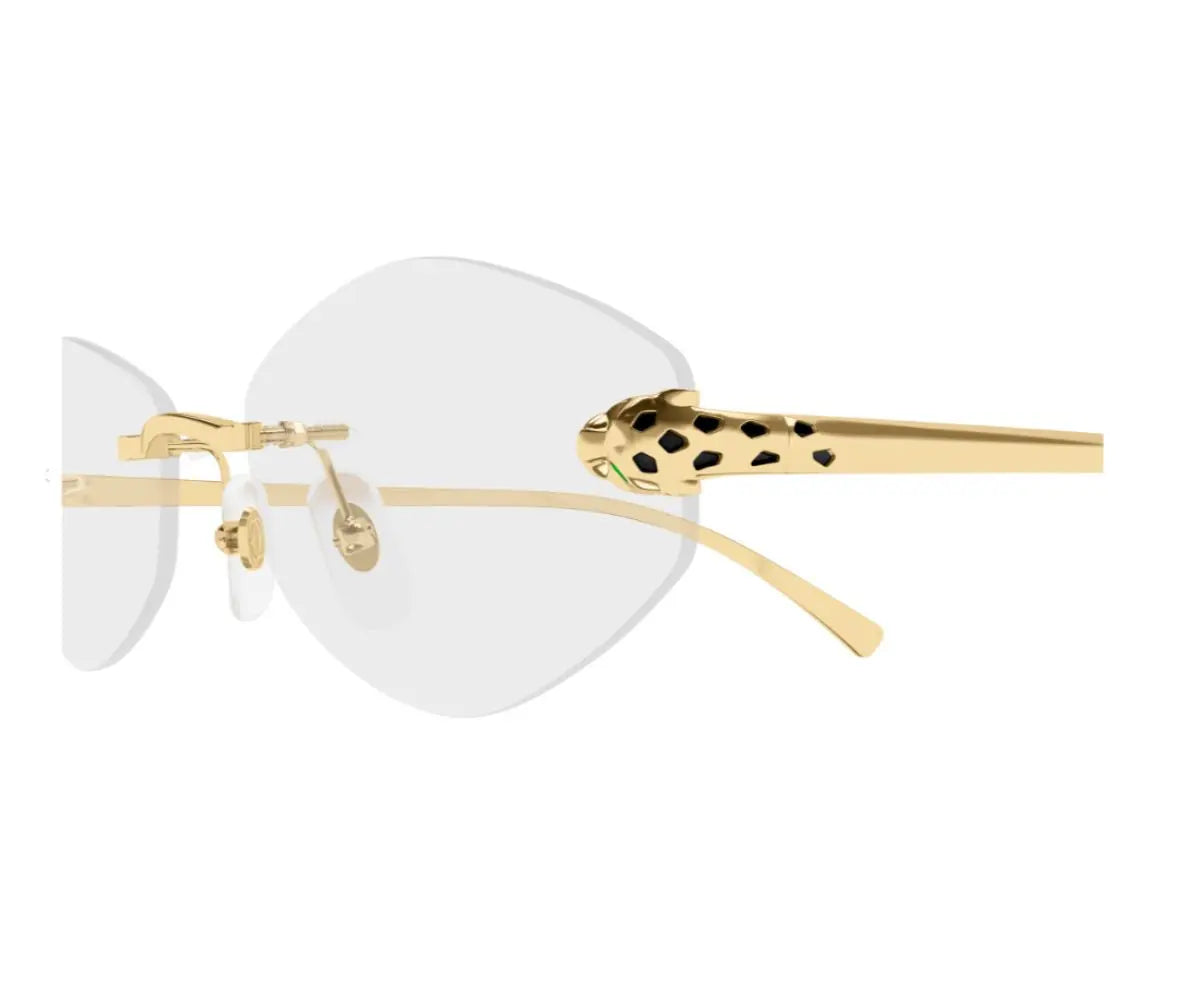 Gold-rimmed eyeglasses with white lenses on a white background