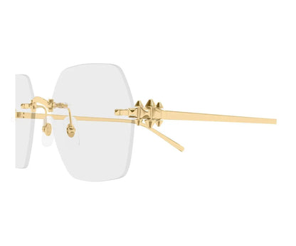 Gold-framed sunglasses with white lenses on a white background