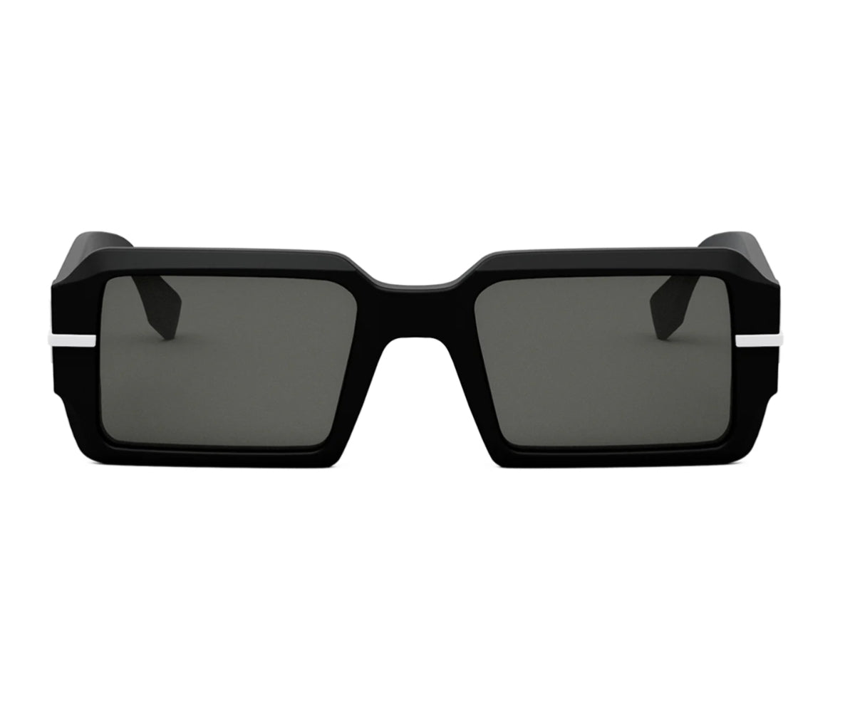 Black sunglasses with a white stripe on a white background